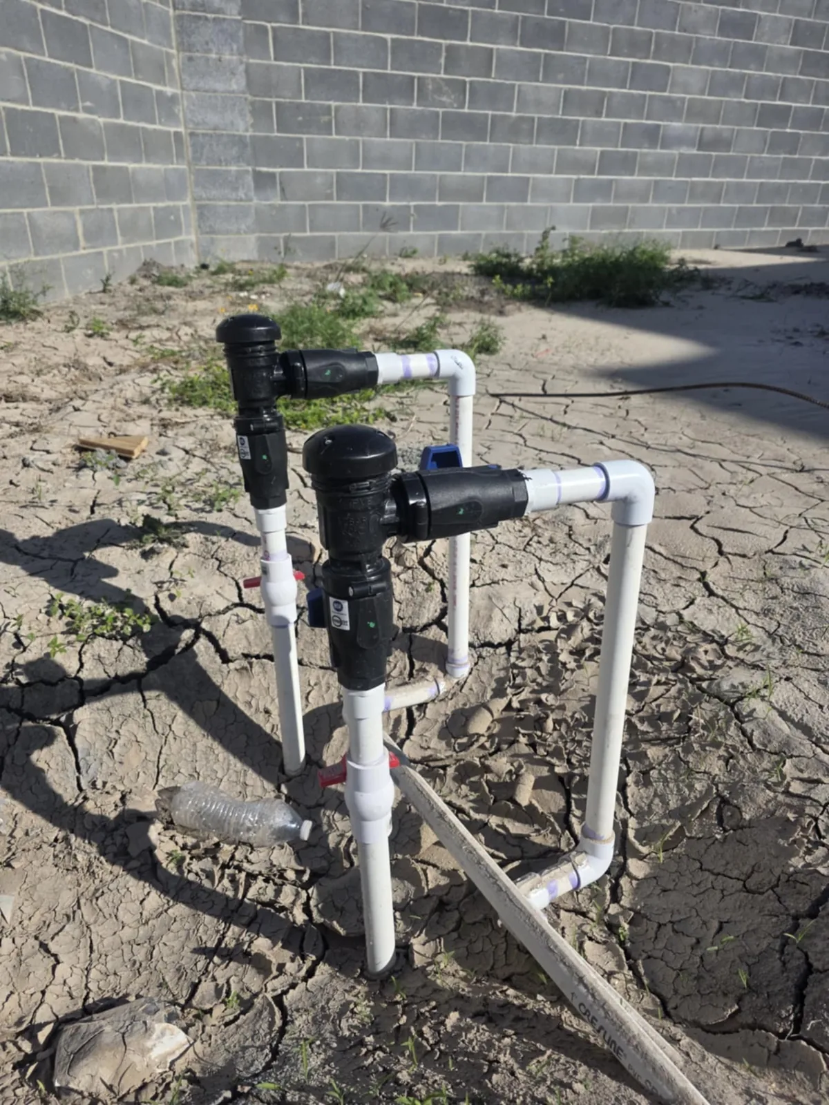 An installed irrigation pipe and valve assembly